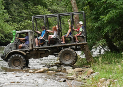 Unimog driving into river