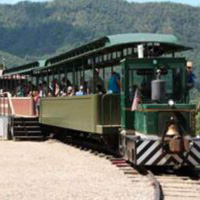 diesel locomotive pulling 2 passenger cars